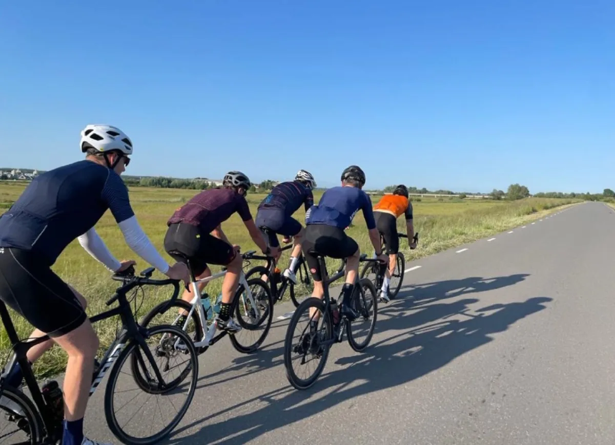 Group of cyclists enjoying a ride together after their bike fitting